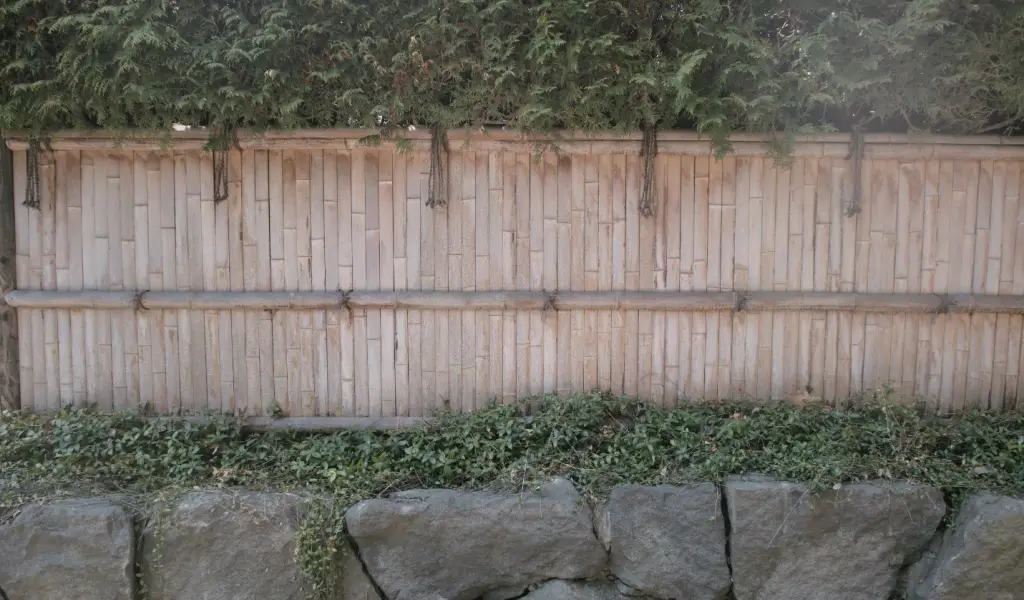 Rock wall privacy fence